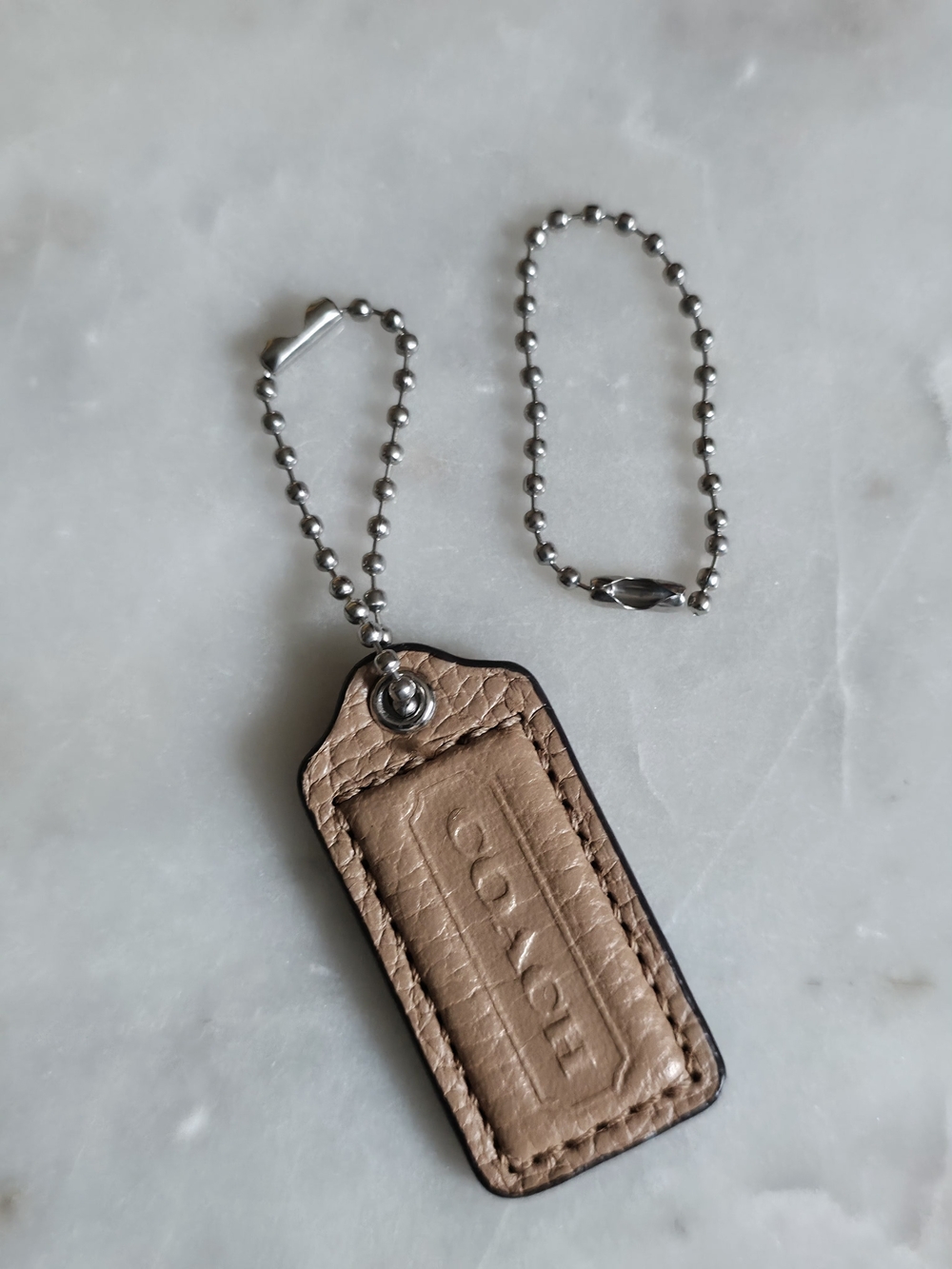 COACH Small Tan Pebbled Leather Hangtag With Silver Grommet And Chains